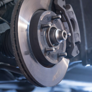 Brake inspection at an automotive workshop